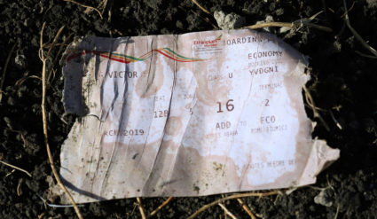 A boarding pass is seen at the scene of the Ethiopian Airlines Flight ET 302 plane crash, near the town of Bishoftu, southeast of Addis Ababa, Ethiopia. Photo by Tiksa Negeri/Reuters