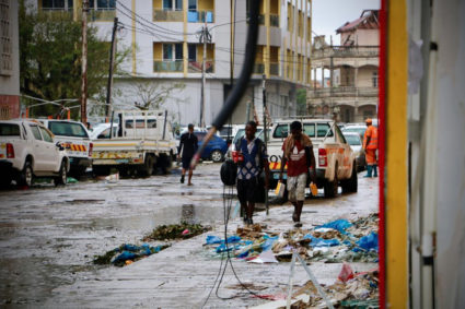 Damages are seen in a street of Beira, Mozambique, on March 17, 2019, in the aftermath of the passage of the cyclone Idai. Photo by Adrien Barbier/AFP/Getty Images