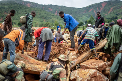 Members of the public and military personnel search for survivors and bodies in Ngangu township Chimanimani, Manicaland Province, eastern Zimbabwe, on March 18 2019, after the area was hit by the cyclone Idai. Photo by Zinyange Auntony/AFP/Getty Images