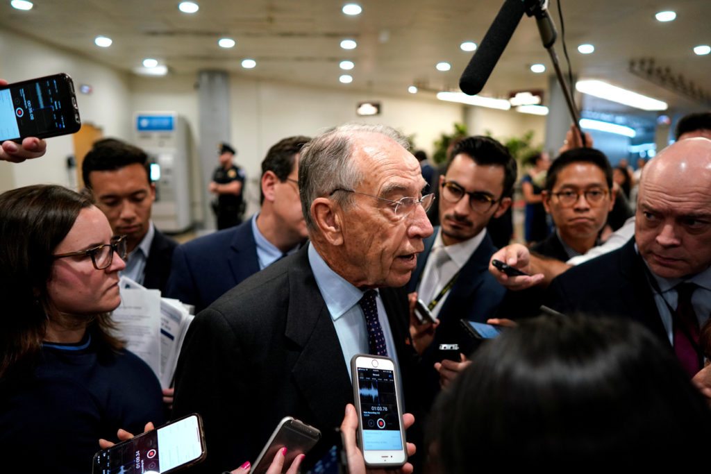 Sen. Chuck Grassley (R-IA) speaks with reporters on the from the Senate floor on Capitol Hill in Washington, U.S., October...