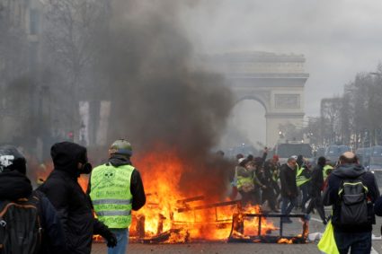 French rioters set fire to Paris bank; mother, child saved