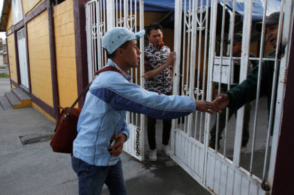 Honduran migrant Ariel, 19, leaves a shelter in Tijuana, Mexico to go to a court hearing in the U.S. Ariel is one of the first asylum seekers who have been returned to Mexico to await their legal proceedings under a new policy established by the U.S. government. Photo by Jorge Duenes/Reuters