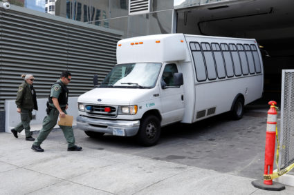 A vehicle, carrying asylum seekers brought from Tijuana, Mexico to the United States for their immigration hearing, arrives at a court in San Diego, California, on March 19, 2019. Photo by Mike Blake/Reuters