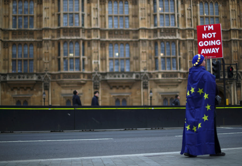 An anti-Brexit protester is seen outside the Houses of Parliament in London on March 20, 2019. Photo by Hannah McKay/Reuters