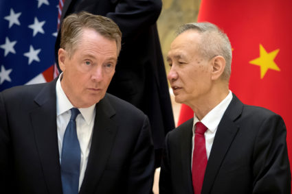 U.S. Trade Representative Robert Lighthizer, left, listens as Chinese Vice Premier Liu He talks while they line up for a group photo at the Diaoyutai State Guesthouse in Beijing on February 15, 2019. Photo by Mark Schiefelbein/Pool via Reuters