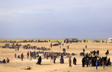 A general view of people walking near Baghouz, Deir Al Zor province, Syria March 5, 2019. Photo by Rodi Said/Reuters