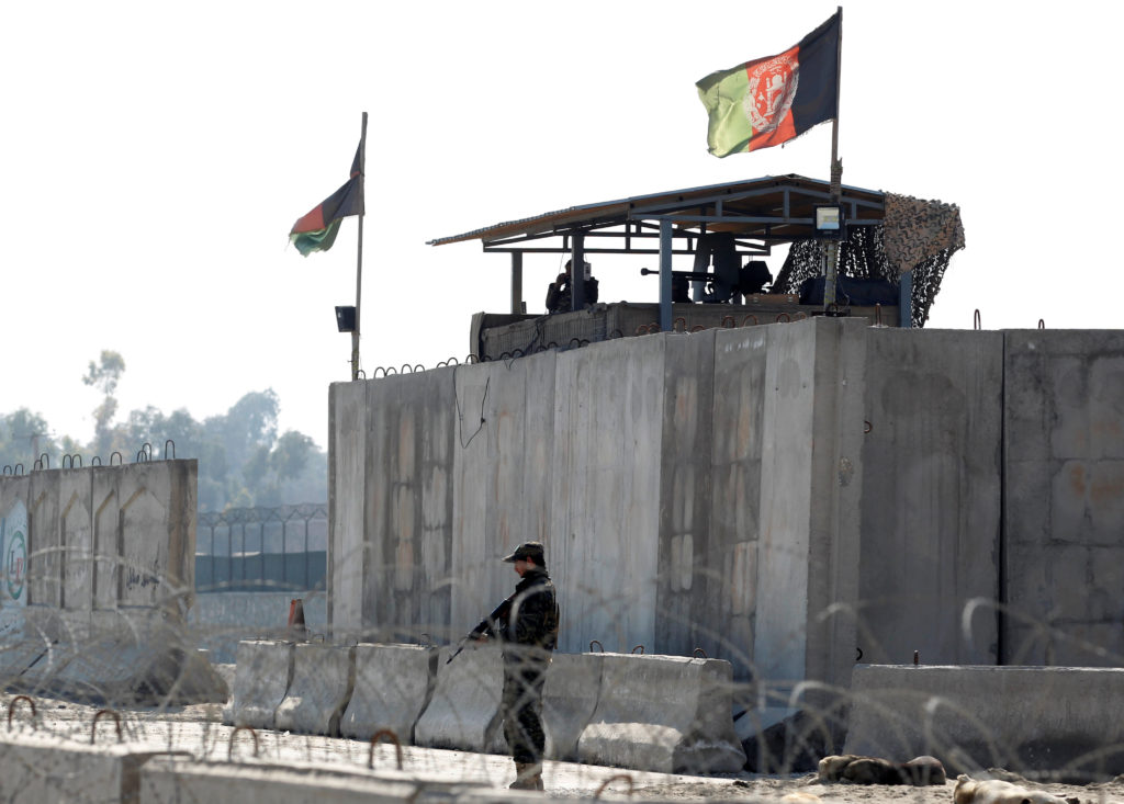Afghan security forces stand guard near the site of an attack in Jalalabad, Afghanistan on March 6, 2019. Photo by Parwiz/...