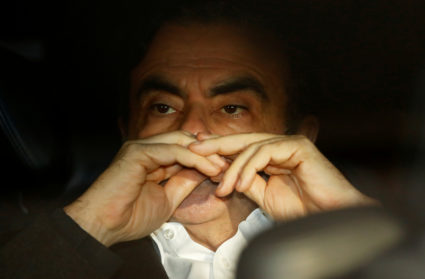 Former Nissan Motor Chairman Carlos Ghosn sits inside the car as he leaves his lawyer's office after being released on bail from Tokyo Detention House in Japan on March 6, 2019. Photo by Issei Kato/Reuters
