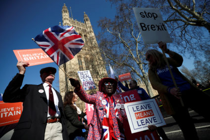 Pro-Brexit and anti-Brexit protesters stand outside of the Houses of Parliament in London, onFebruary 27, 2019. Photo by Hannah Mckay/Reuters