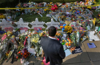 A man prays at a makeshift memorial outside the Tree of Life synagogue following Saturday's shooting at the synagogue in Pittsburgh, Pennsylvania, U.S., October 31, 2018. Photo by Cathal McNaughton/Reuters
