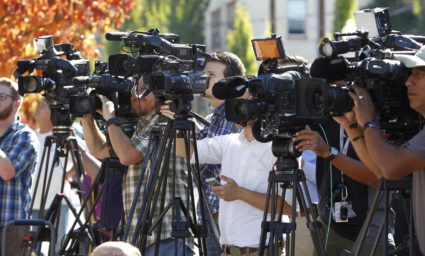 Television media cover a news conference about a mass shooting in Roseburg. Photo by REUTERS/Steve Dipaola