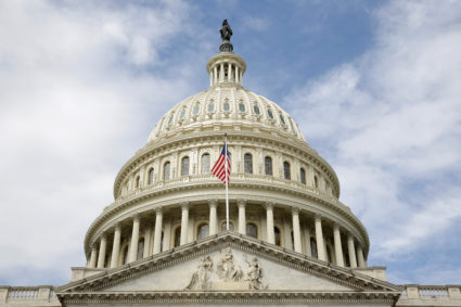 The U.S. flag flies in front of the Capitol Dome at the U.S. Capitol in Washington, U.S., September 12, 2017. File photo by Joshua Roberts/Reuters