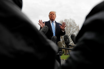 President Donald Trump talks to reporters as he departs for travel to the U.S.-Mexico border from the White House in Washington, D.C. Photo by Carlos Barria/Reuters