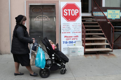 A sign warning people of measles in the ultra-Orthodox Jewish community of Williamsburg, two days after New York City Mayor Bill de Blasio declared a public health emergency in parts of Brooklyn in response to a measles outbreak, is seen in New York, April 11, 2019. Photo by Shannon Stapleton/Reuters