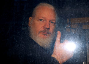 FILE PHOTO: WikiLeaks founder Julian Assange is seen as he leaves a police station in London, Britain April 11, 2019. Photo by Peter Nicholls/Reuters