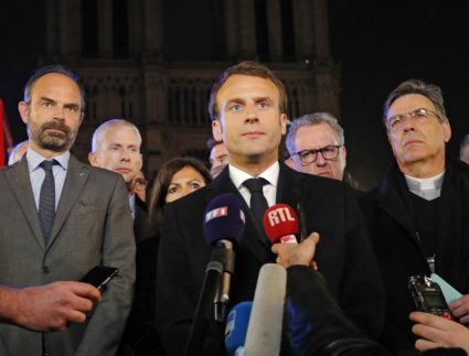 French President Emmanuel Macron speaks in front of the Notre Dame Cathedral in Paris on April 15, 2019. Photo by REUTERS/Philippe Wojazer/Pool