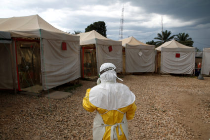 A health worker wearing Ebola protection gear, walks before entering the Biosecure Emergency Care Unit (CUBE) at the ALIMA (The Alliance for International Medical Action) Ebola treatment centre in Beni, in the Democratic Republic of Congo, March 30, 2019. Photo by Baz Ratner/Reuters