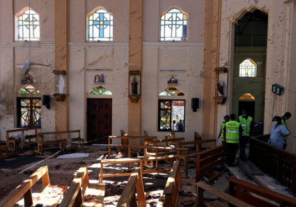 Police officers work at the scene at St. Sebastian Catholic Church, after bomb blasts ripped through churches and luxury hotels on Easter, in Negombo, Sri Lanka on April 22, 2019. Photo by Athit Perawongmetha/Reuters