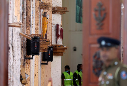 Police officers work at the scene at St. Sebastian Catholic Church, after bomb blasts ripped through churches and luxury hotels on Easter, in Negombo, Sri Lanka. Photo by Athit Perawongmetha/Reuters