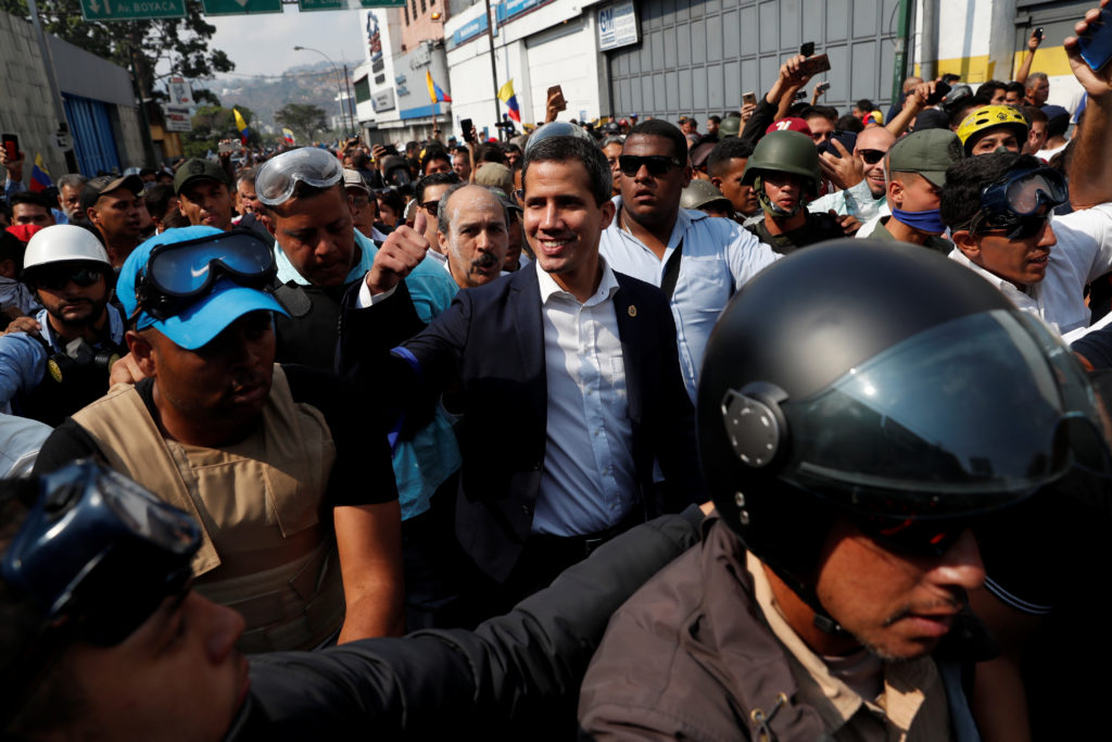 Venezuelan opposition leader Juan Guaido, who many nations have recognized as the country's rightful interim ruler, gestur...