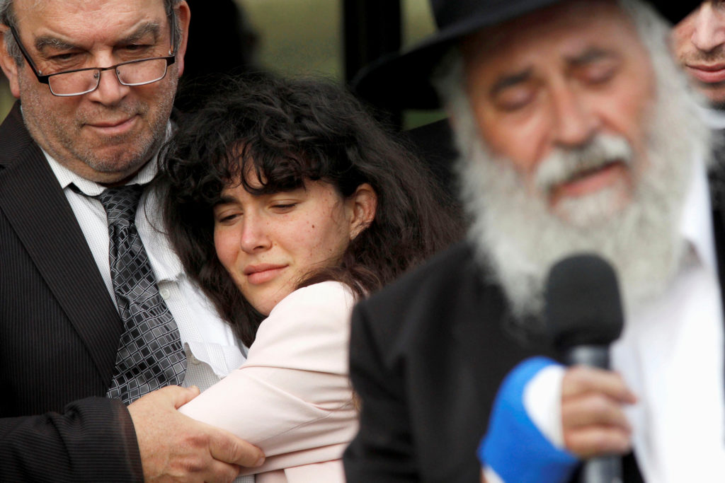 Howard Kaye holds his daughter Hannah Jacqueline Kaye at the funeral for Lori Gilbert-Kaye, the sole fatality of the Satur...