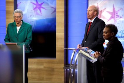 Fox 32 Chicago moderator Mike Flannery (center) and Chicago mayoral election candidates Toni Preckwinkle (left) and Lori Lightfoot (right) appear during a recorded forum in Chicago on March 26, 2019. Photo by Joshua Lott/Reuters