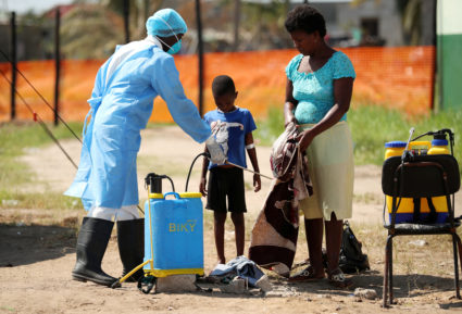 Medical staff spray disinfectant at a cholera treatment centre set up in the aftermath of Cyclone Idai in Beira, Mozambique, March 29, 2019. Photo by Mike Hutchings/Reuters