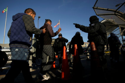 Commuters show their Visa cards to U.S. Customs and Border Protection agents to cross into El Paso, Texas, at Paso del Norte international border crossing bridge, in Ciudad Juarez, Mexico April 1, 2019. Photo by Jose Luis Gonzalez/Reuters