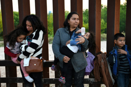 Central American migrants turn themselves in to U.S. Border Patrol as they seek asylum after illegally crossing the Rio Grande near Penitas, Texas, on April 6, 2019. Photo by Loren Elliott/Reuters