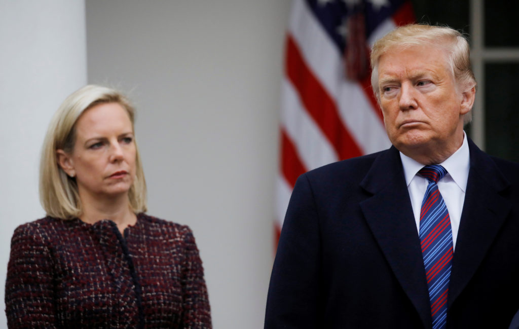 U.S. President Donald Trump speaks to reporters as Department of Homeland Security Secretary Kirstjen Nielsen looks on in ...