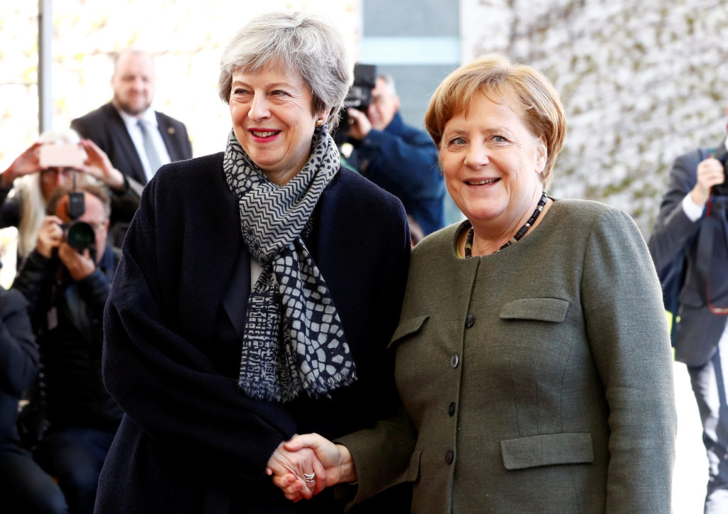 British Prime Minister Theresa May is welcomed by German Chancellor Angela Merkel, as they meet to discuss Brexit, at the ...