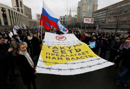 People attend a rally to protest against tightening state control over internet in Moscow, Russia, March 10, 2019. The banner reads: "Such network prepared by authorities." Photo by Shamil Zhumatov/Reuters