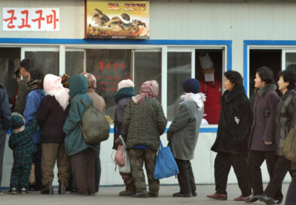 People line up in front of a food store in Pyongyang November 26, 2010. Photo by Kyodo via Reuters
