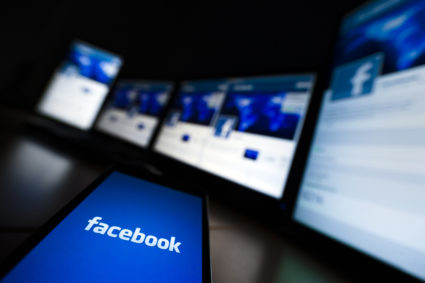 The loading screen of the Facebook application on a mobile phone is seen in this photo illustration. Photo by Valentin Flauraud/Reuters