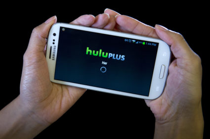 The HULU Plus app is played on a Samsung Galaxy phone in this photo-illustration. Photo by Carlo Allegri/Reuters