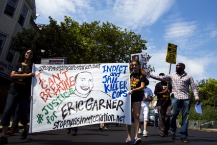 Demonstrators protest as they march to the location where Eric Garner was killed on the one year anniversary of his death in New York, July 17, 2015. Family and supporters on Friday marked the anniversary of the police killing of Eric Garner with rallies and vigils demanding police reforms and justice in the controversial case. Photo by Lucas Jackson/Reuters