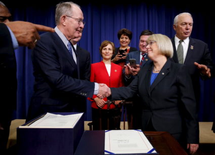 U.S. Senator Lamar Alexander (R-TN) and Senator Patty Murray (D-WA) shake hands to celebrate the Every Student Succeeds Act in Washington, on December 10, 2015. The senators have once again teamed up to address surprise medical bills. Photo by Jonathan Ernst/Reuters