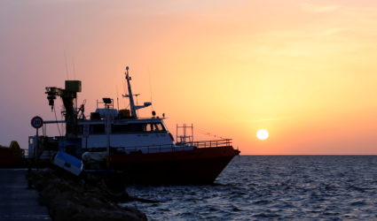 A boat is seen at a harbour off the cost of Tunisia. Picture taken June 4, 2018. Photo by Zoubeir Souissi/Reuters