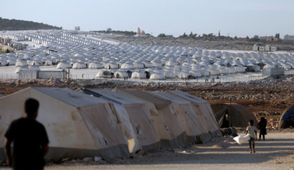 Newly displaced Syrians arrive to a refugee camp in Atimah village, Idlib province, Syria, on September 11, 2018. Photo by Khalil Ashawi/Reuters