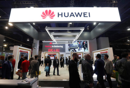 Attendees pass by a Huawei booth during the 2019 CES in Las Vegas, Nevada, on January 9, 2019. Photo by Steve Marcus/Reuters