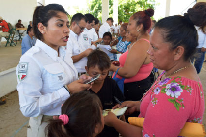Officials of the National Migration Institute register migrants from Central America and Cuba for humanitarian visas to cross the country on their way to the United States, in Acacoyagua, in Chiapas state, Mexico on March 27, 2019. Photo by Jose Torres/Reuters