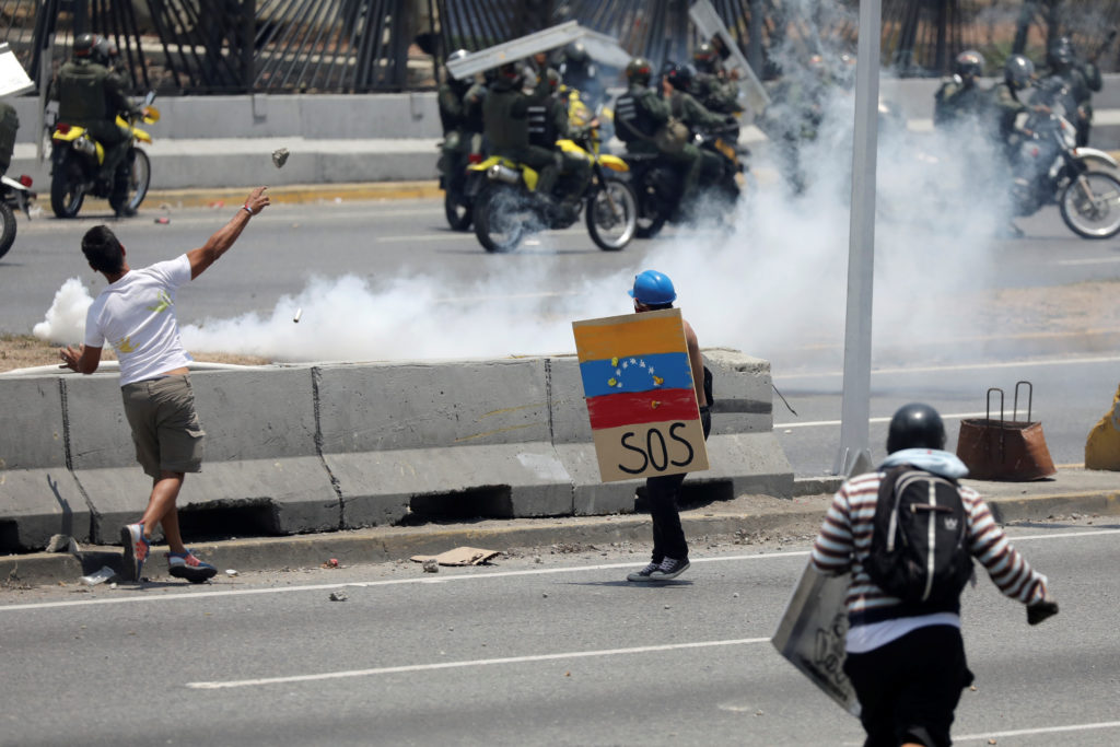 Supporters of Venezuelan opposition leader Juan Guaido, who many nations have recognised as the country's rightful interim...