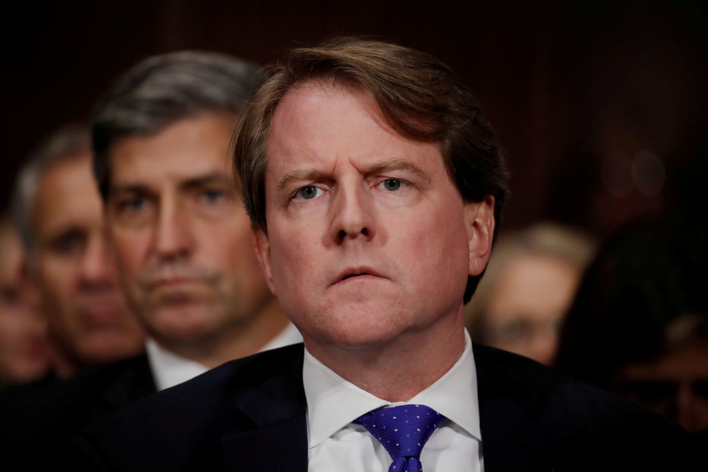 FILE PHOTO: White House Counsel Don McGahn listens to U.S. Supreme Court nominee Brett Kavanaugh testify before a Senate J...