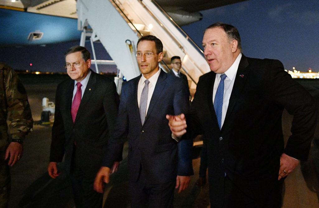 Secretary of State Mike Pompeo walks with Acting Assistant Secretary for Near Eastern Affairs at the State Department Davi...
