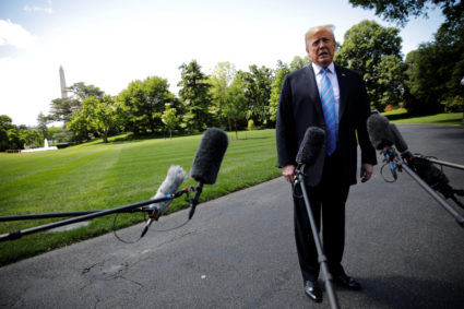 President Donald Trump talks to reporters as he departs for travel to Louisiana from the White House in Washington, on May 14, 2019. Photo by Carlos Barria/Reuters
