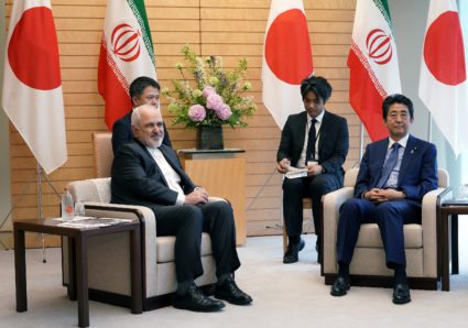 Iranian Foreign Minister Mohammad Javad Zarif, left, and Japanese Prime Minister Shinzo Abe, right, speak at Abe's official residence in Tokyo. Photo by Eugene Hoshiko/Pool via Reuters