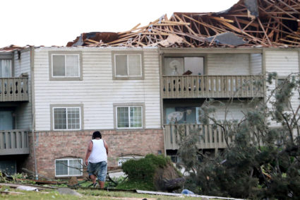 A man walks through the scattered debri outside his apartment building in the morning after a tornado touched down overnight in Trotwood near Dayton, Ohio, on May 28, 2019. Photo by Aaron Josefczyk/Reuters