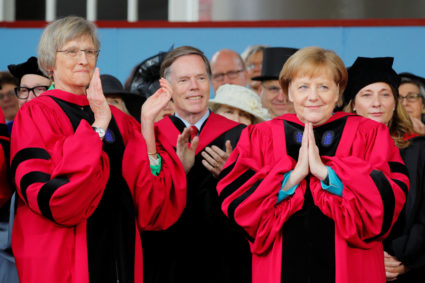 German Chancellor Angela Merkel acknowledges the applause, including from fellow honorary degree recipient Drew Faust (left), as Merkel receives an honorary Doctor of Laws degree during the 368th Commencement Exercises at Harvard University in Cambridge, Massachusetts, on May 30, 2019. Photo by Brian Snyder/Reuters
