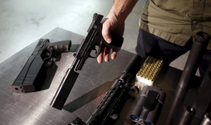 SilencerCo CEO Joshua Waldron shows guns with suppressors in West Valley City, Utah February 23, 2016. Gun silencers or suppressors, the accessory of Hollywood hit men, are becoming increasingly popular in the real world as hunters and other gun owners adopt them for hearing protection. Photo by Jim Urquhart/Reuters