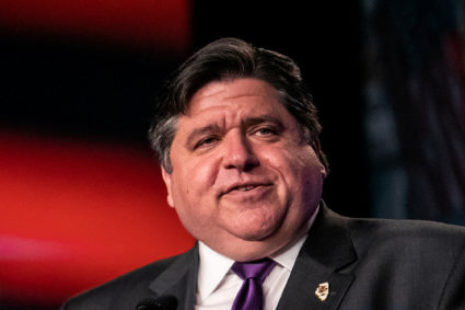 FILE PHOTO: lllinois Governor J.B. Pritzker delivers remarks at the North America's Building Trades Unions (NABTU) 2019 legislative conference in Washington, U.S., April 9, 2019. Photo by REUTERS/Jeenah Moon/File Photo